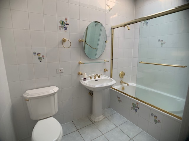 220 Bradwell Road Inverness, IL 60010 - Photo 18 of 20 a bathroom with a sink toilet and a mirror