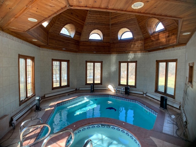 220 Bradwell Road Inverness, IL 60010 - Photo 5 of 20 a living room with a bed furniture and a large window