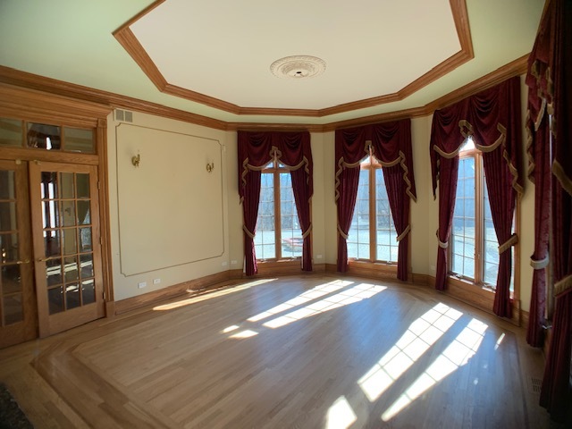 220 Bradwell Road Inverness, IL 60010 - Photo 7 of 20 a view of empty room with wooden floor and fan
