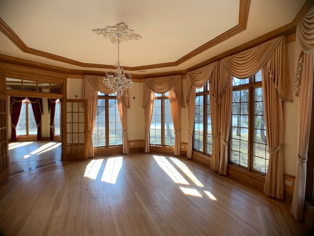 220 Bradwell Road Inverness, IL 60010 - Photo 8 of 20 a view of an entryway with wooden floor and door