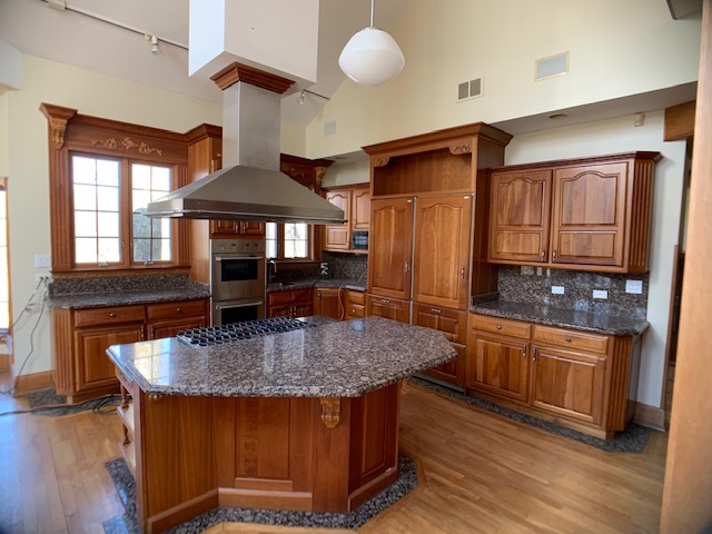 220 Bradwell Road Inverness, IL 60010 - Photo 9 of 20 a kitchen with stainless steel appliances granite countertop a stove a sink and a refrigerator