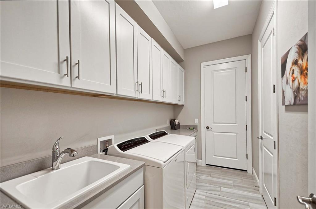 2166 Antigua Lane Naples, FL 34120 - Photo 21 of 35 a view of a storage and utility room with a sink