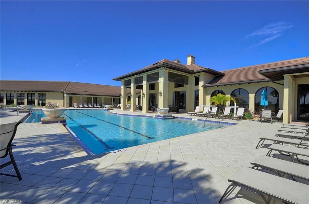 2166 Antigua Lane Naples, FL 34120 - Photo 29 of 35 a view of a house with pool and chairs