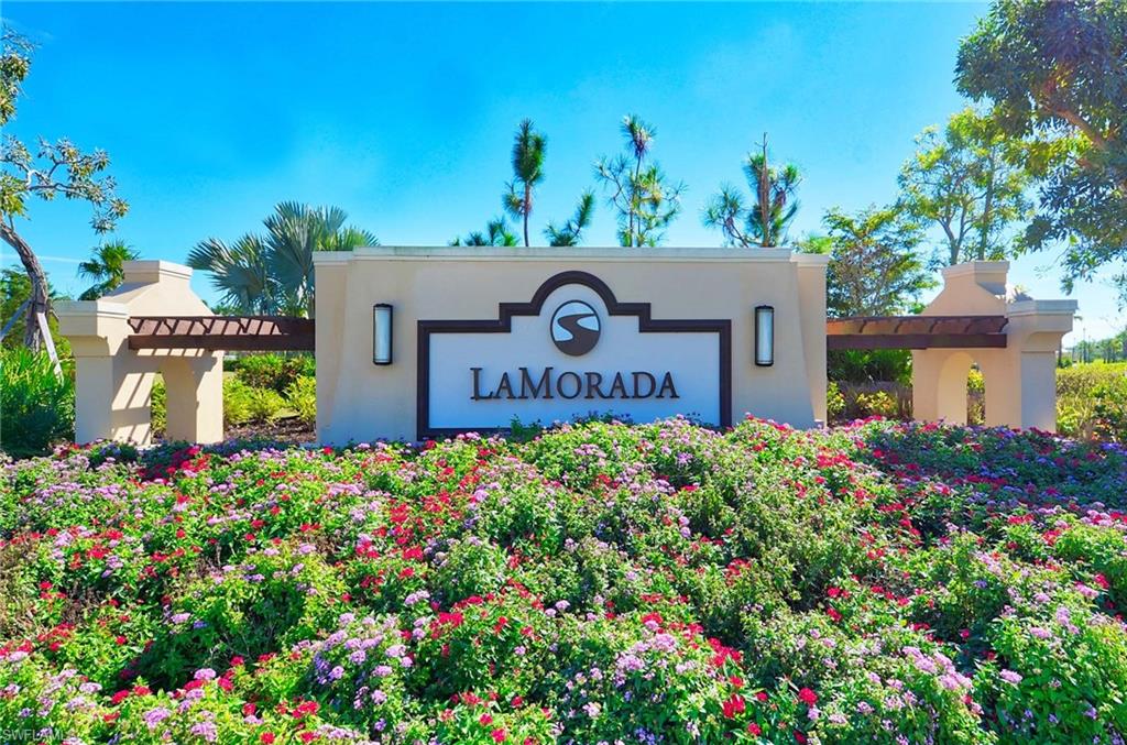 2166 Antigua Lane Naples, FL 34120 - Photo 35 of 35 a front view of a house with a yard and garage