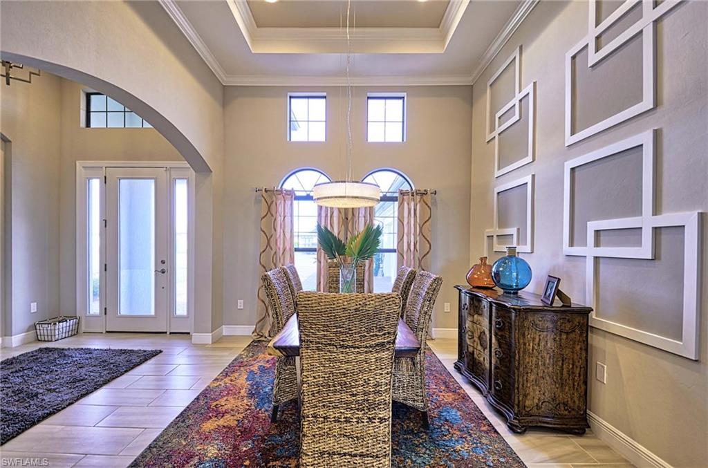 2166 Antigua Lane Naples, FL 34120 - Photo 7 of 35 a front view of a house with outdoor seating