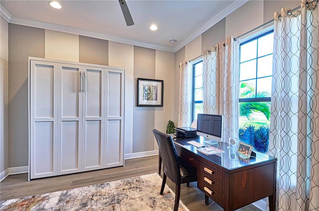 2166 Antigua Lane Naples, FL 34120 - Photo 8 of 35 a dining room with furniture and window