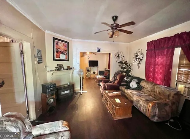 a living room with furniture and a flat screen tv