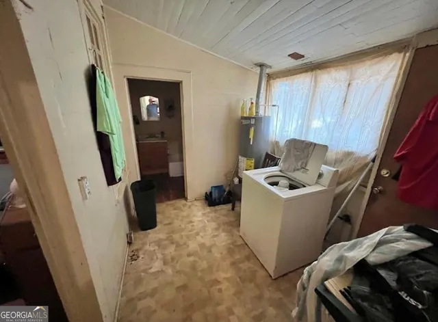 a room with furniture and a window