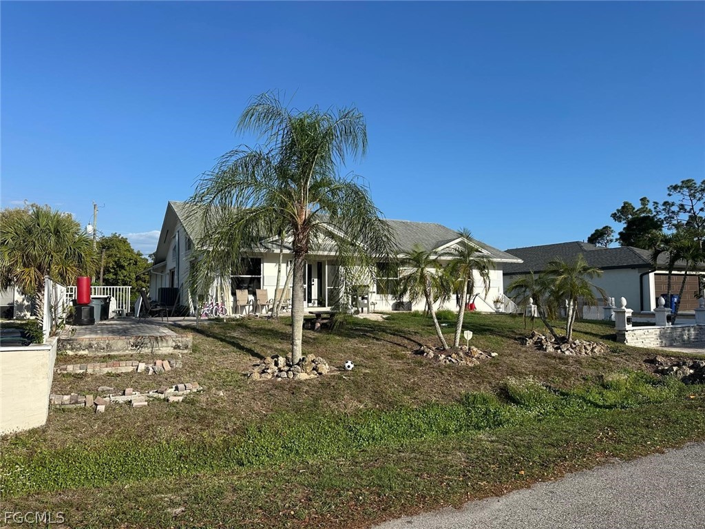 19751 Adams Road Fort Myers, FL 33908 - Photo 3 of 6 a view of a town with palm trees
