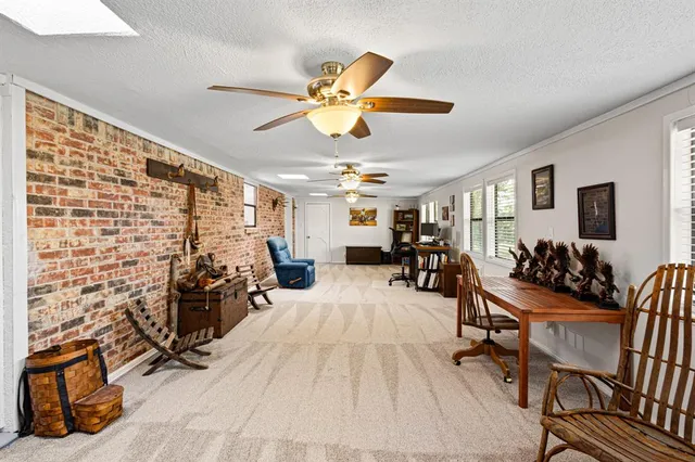 a view of a livingroom with furniture and a livingroom