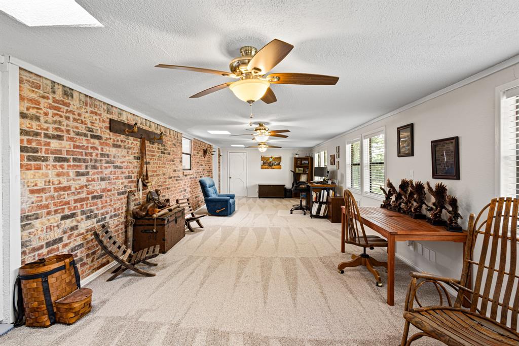818 Country Club Road Bowie, TX 76230 - Photo 12 of 34 a view of a livingroom with furniture and a livingroom