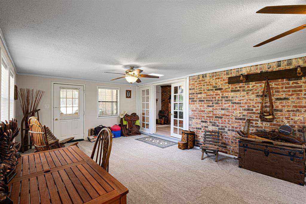 818 Country Club Road Bowie, TX 76230 - Photo 14 of 34 a view of a livingroom with furniture and windows