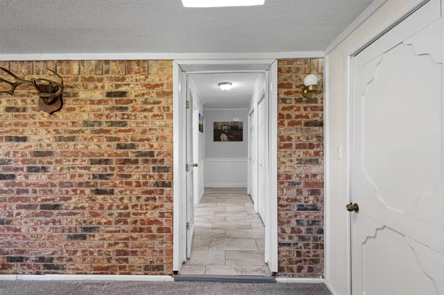 a kitchen with stainless steel appliances a refrigerator and a stove top oven