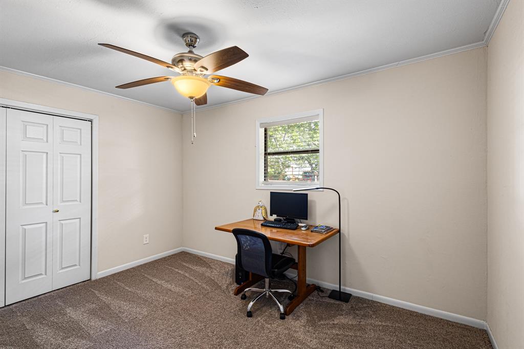 818 Country Club Road Bowie, TX 76230 - Photo 22 of 34 a workspace with furniture and a window