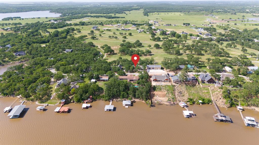 818 Country Club Road Bowie, TX 76230 - Photo 31 of 34 an aerial view of a houses with a street