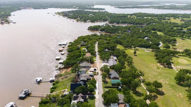 an aerial view of a residential houses with lake view