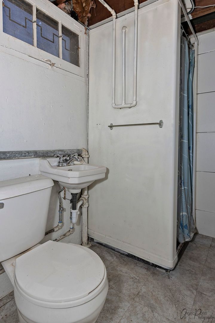 35273 North Wilson Road Ingleside, IL 60041 - Photo 33 of 39 a bathroom with a toilet and a sink