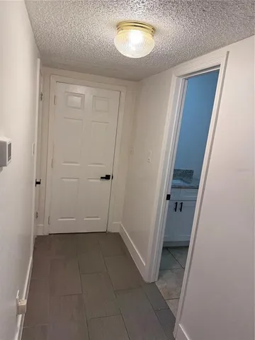 an empty room with wooden floor and closet