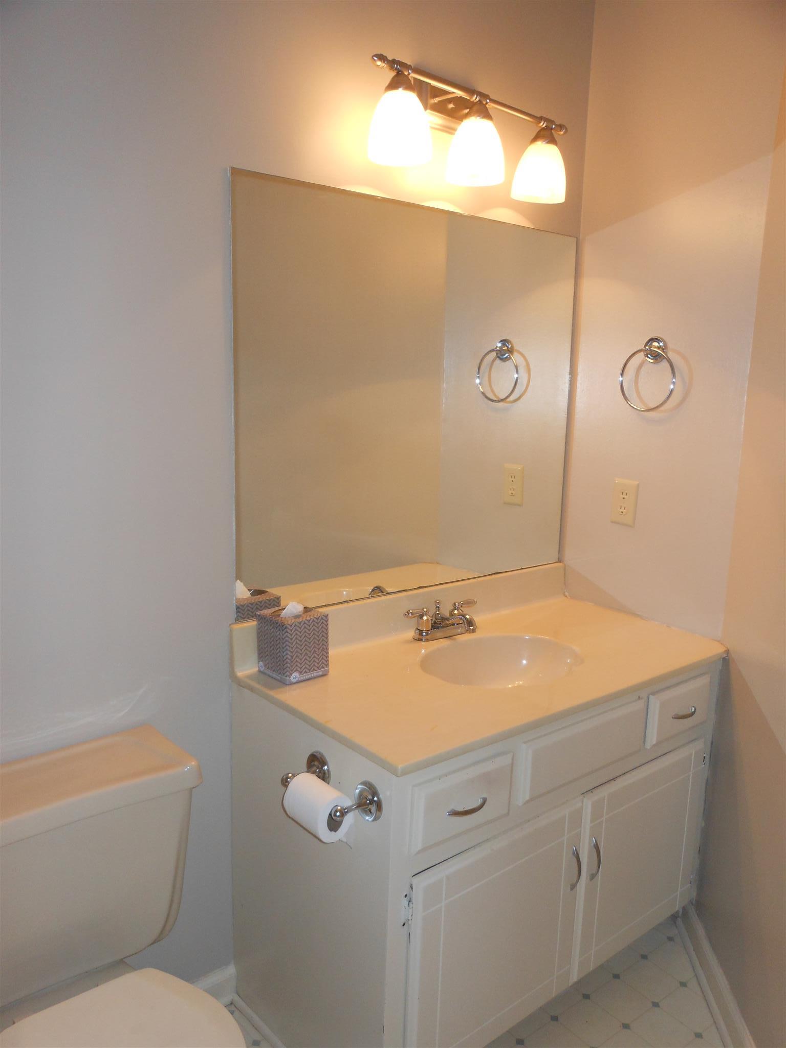 3244 B Anderson Road Antioch, TN 37013 - Photo 5 of 9 a bathroom with a sink and mirror with toilet