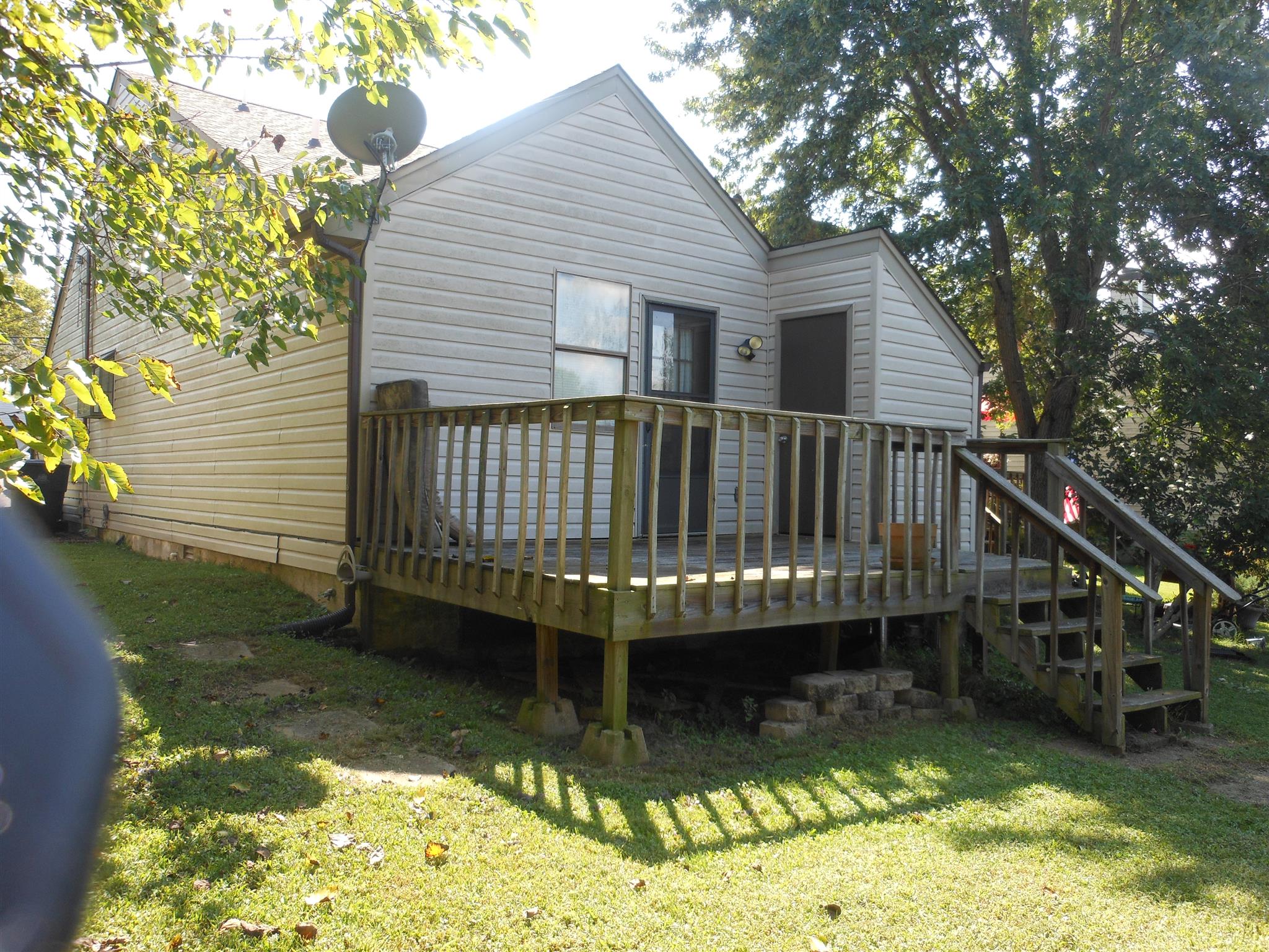 3244 B Anderson Road Antioch, TN 37013 - Photo 9 of 9 a view of house with swimming pool and a yard