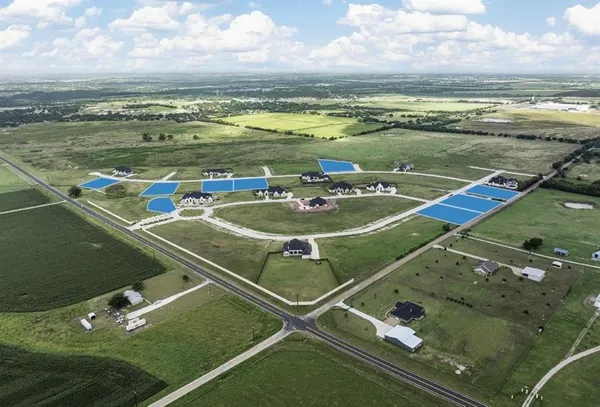 a view of a pool with a table and chairs in the terrace
