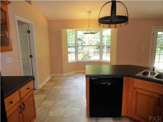 5524 Fox Fire Road Milton, FL 32570 - Photo 12 of 25 VIEW OF BREAKFAST NOOK WITH LARGE WINDOWS- ALSO BREAKFAST BAR