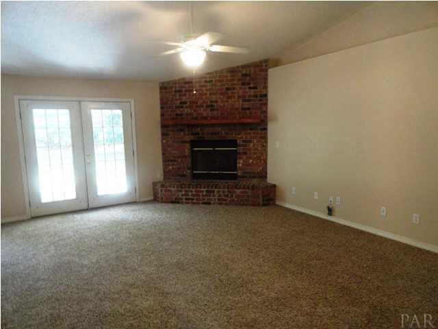 5524 Fox Fire Road Milton, FL 32570 - Photo 6 of 25 GREATROOM WITH CORNER GAS(PROPANE) FIREPLACE, PLANT LEDGES, CEILING FAN AND VAULTED CEILING