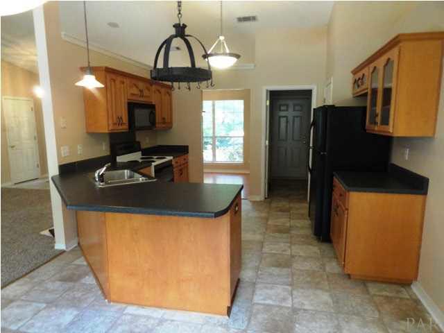 5524 Fox Fire Road Milton, FL 32570 - Photo 7 of 25 KITCHEN IS WONDERFUL- NEW VINYL FLOORING WITH LARGE TILE PATTERN, LOOKS LIKE TILE.