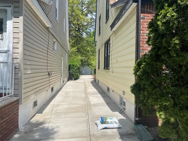 a bedroom with a bed and a potted plant