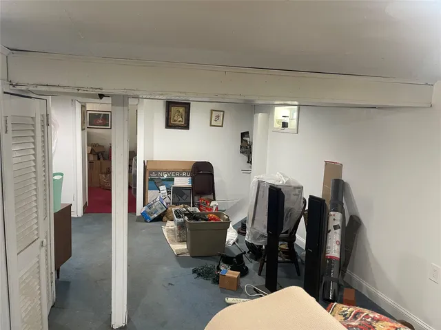 a bathroom with a granite countertop toilet and a sink