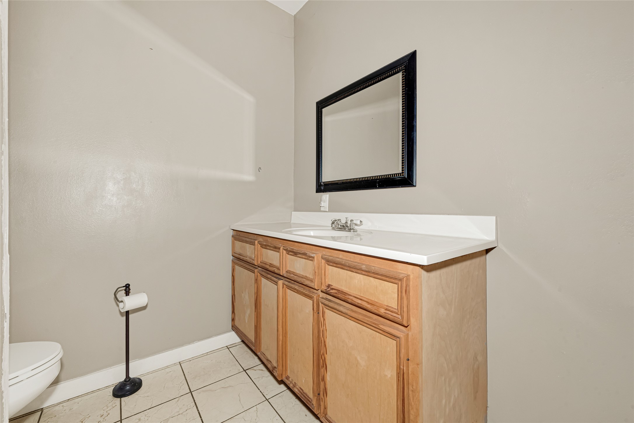 7305 Tremper Street Houston, TX 77020 - Photo 18 of 28 a bathroom with a sink vanity and a mirror