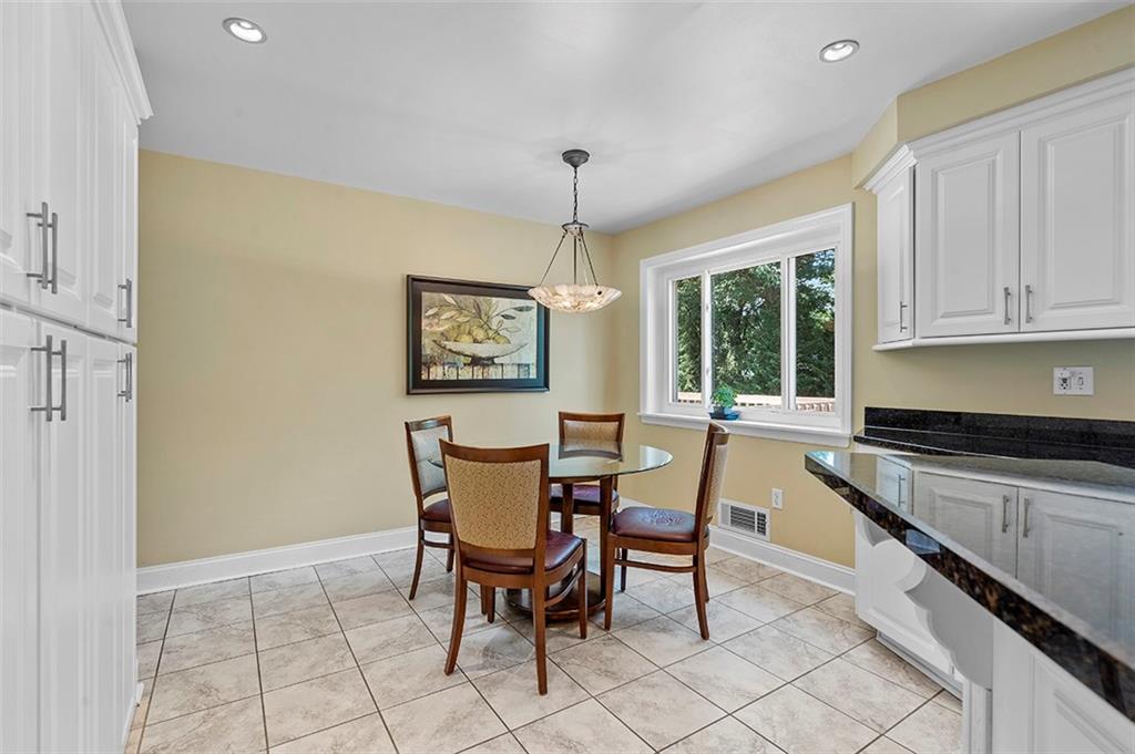 533 Woodland Road Pittsburgh, PA 15237 - Photo 14 of 43 a view of a dining room with furniture and chandelier