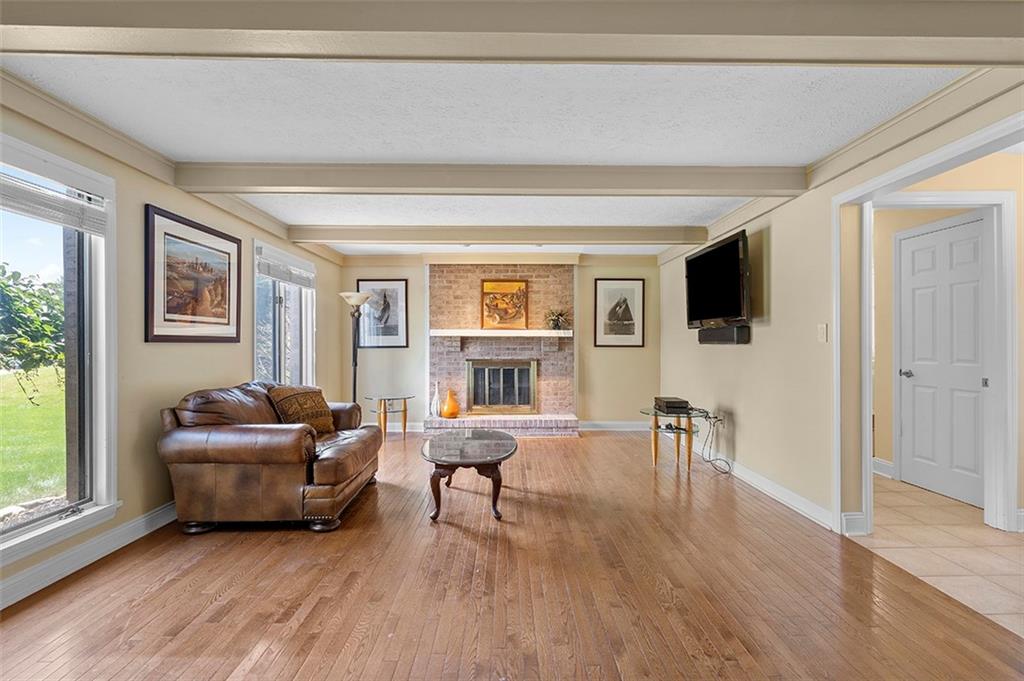 533 Woodland Road Pittsburgh, PA 15237 - Photo 15 of 43 a living room with furniture and a flat screen tv