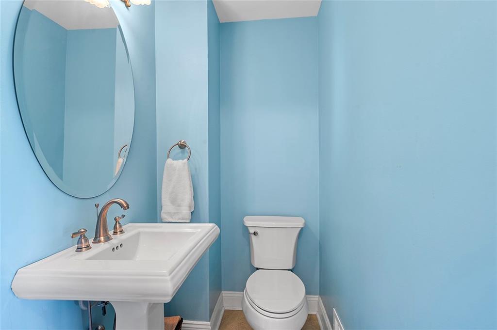 533 Woodland Road Pittsburgh, PA 15237 - Photo 19 of 43 a white toilet sitting next to a bathroom sink