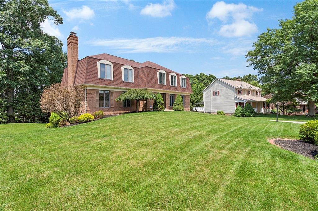 533 Woodland Road Pittsburgh, PA 15237 - Photo 2 of 43 a front view of a house with garden