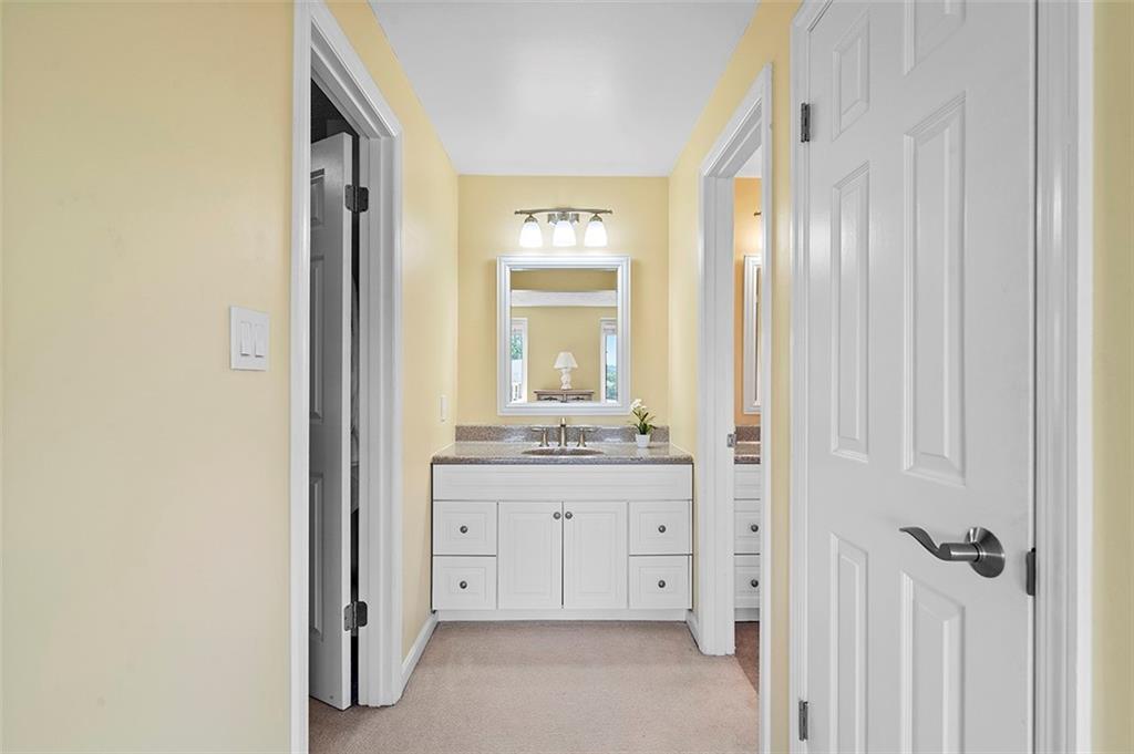 533 Woodland Road Pittsburgh, PA 15237 - Photo 23 of 43 a bathroom with a granite countertop sink and a mirror