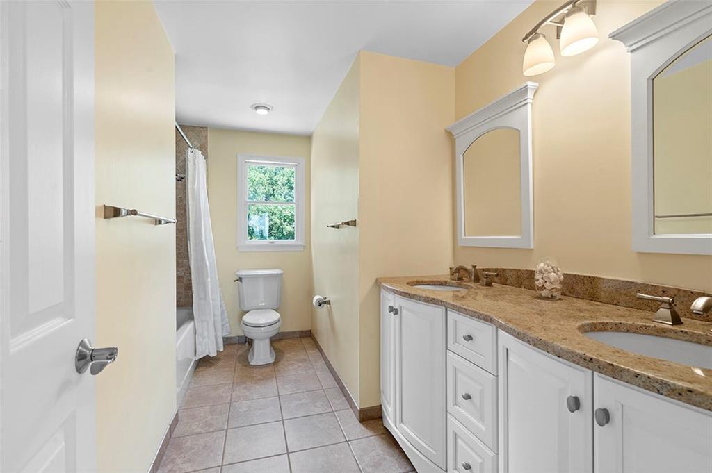 533 Woodland Road Pittsburgh, PA 15237 - Photo 27 of 43 a bathroom with a granite countertop sink toilet and shower