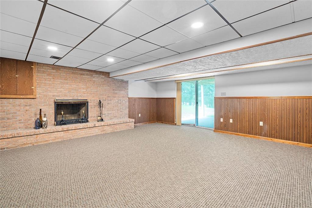 533 Woodland Road Pittsburgh, PA 15237 - Photo 35 of 43 a view of an empty room with a fireplace and a window