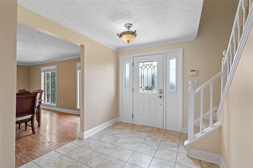 533 Woodland Road Pittsburgh, PA 15237 - Photo 5 of 43 a view of an entryway with wooden floor and a livingroom