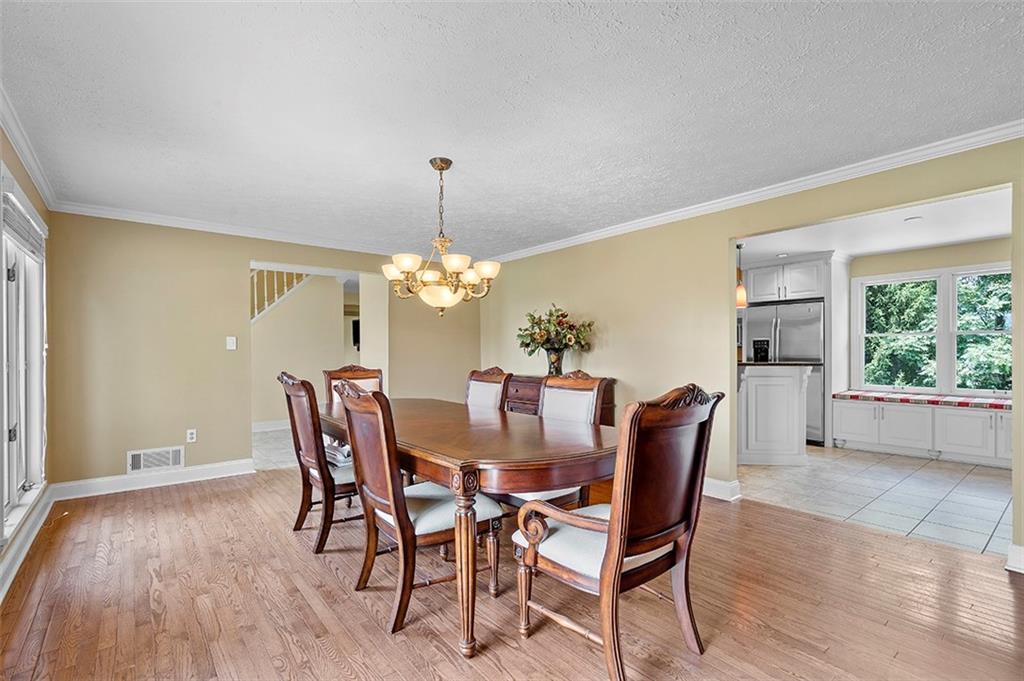 533 Woodland Road Pittsburgh, PA 15237 - Photo 7 of 43 a view of a dining room with furniture window and wooden floor