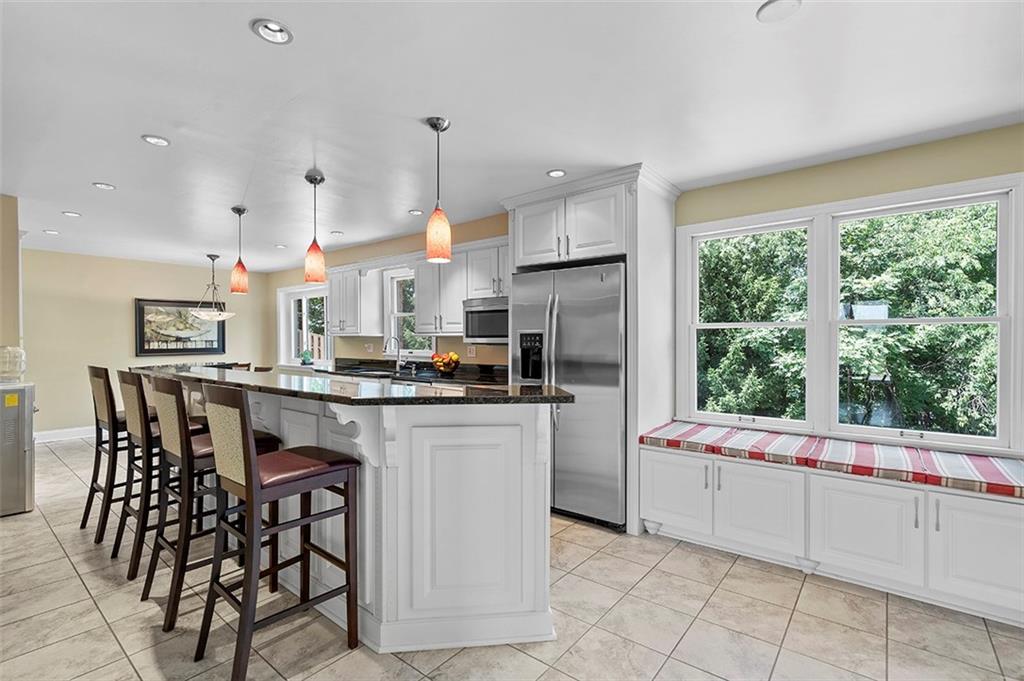 533 Woodland Road Pittsburgh, PA 15237 - Photo 10 of 43 a kitchen with kitchen island a large window in it and kitchen island