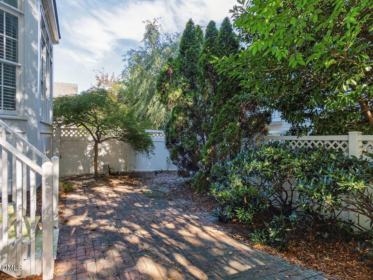 3900 Bentley Bridge Road Raleigh, NC 27612 - Photo 27 of 27 a view of a yard with plants and trees