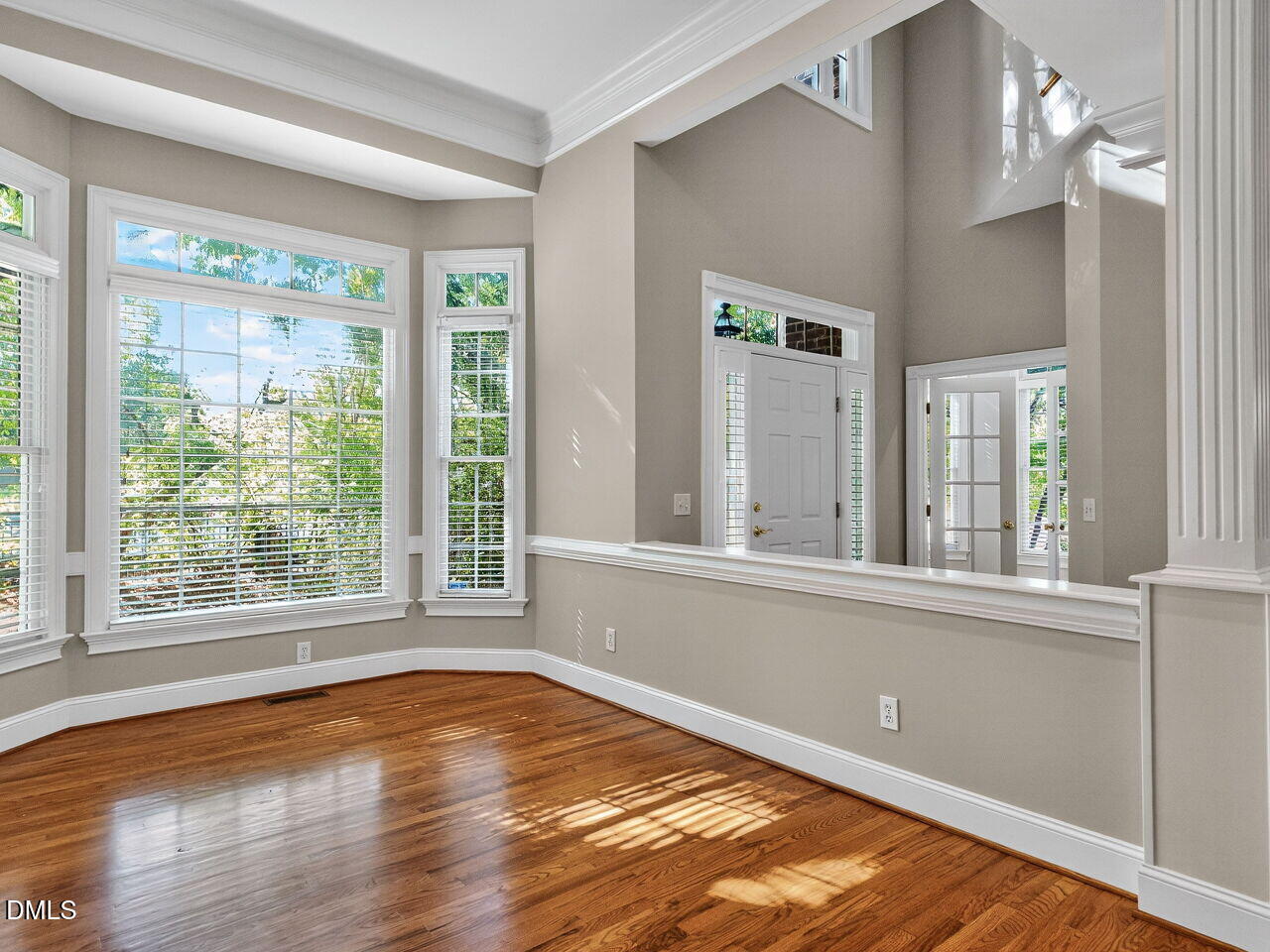 3900 Bentley Bridge Road Raleigh, NC 27612 - Photo 3 of 27 a view of a room with wooden floor and a window