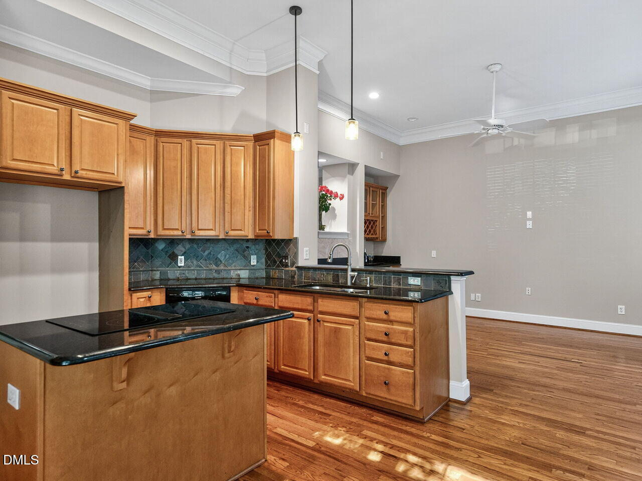 3900 Bentley Bridge Road Raleigh, NC 27612 - Photo 9 of 27 a kitchen with stainless steel appliances granite countertop a sink a stove and a wooden floors