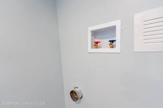 a kitchen with stainless steel appliances granite countertop a refrigerator a stove a sink and a microwave