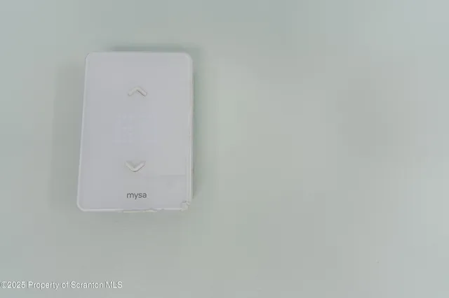 a view of a white house with a yard and large tree