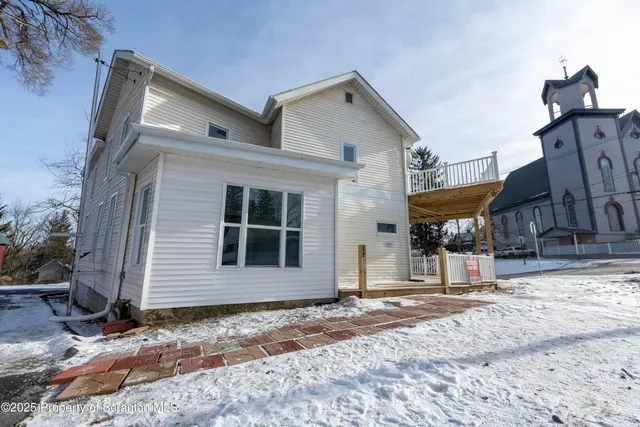 a stove top oven sitting inside of a kitchen