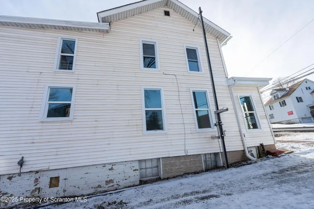 a bathroom with a shower and a toilet