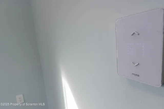 a view of a chairs and table in a patio