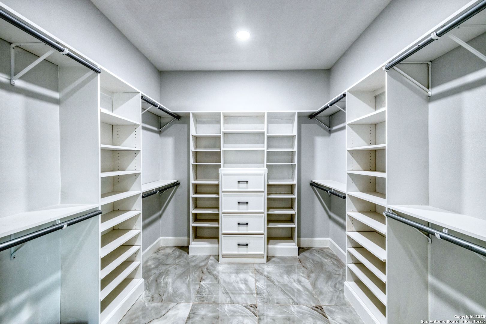 14 Hope Place Uvalde, TX 78801 - Photo 18 of 38 a view of walk in closet with empty racks